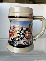 Photo of the beer stein showing the image of Bill Elliott racing with checkered flags and Budweiser branding.