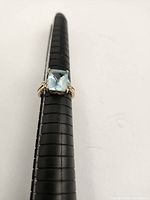 Top view of ring showing rectangular topaz center stone and diamond accents