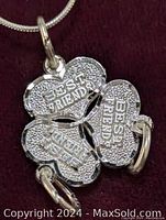 Close-up front view of the silver pendant showing four hearts with "BEST FRIEND" text, attached to silver snake chain.