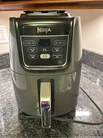 Front view of the Ninja XL AirFryer showing digital control panel and handle