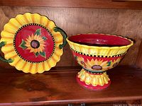 Sunflower two-handled platter and pedestal bowl displayed together showing overall design and color pattern.