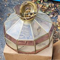 Full view of the 16-inch glass ceiling lamp shade showing the dome shape with clear and pinkish-brown glass panels framed in brass or gold-tone metal strips.