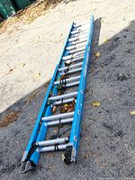 Overall view of Werner ladder collapsed on pavement