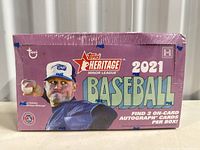 Sealed 2021 Topps Heritage Minor League Baseball trading card box with pitcher image and text showing 2 on-card autograph cards per box.