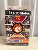 Front view of sealed 2020-21 Panini Chronicles basketball trading card box showing key players and logos.