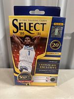 Front view of sealed 2020-21 Panini Select NBA basketball trading cards box showing branding, player image, card count, and exclusive contents.