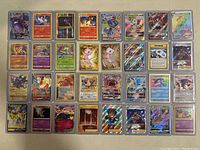 Full view of all 38 Pokemon cards laid out in protective sleeves on a flat surface.