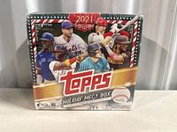 Front of sealed Topps 2021 Holiday Mega Box showing several MLB player images and product branding.