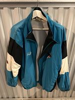 Full front view of vintage Atlanta Sharks jacket showing color-block design and collar style.