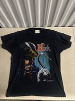 Front view of black vintage Captain Hook graphic t-shirt showing full illustration and logo text.