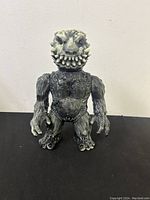 Front view of King Hidous figurine showing head and body details