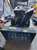 Front view showing 30" auger housing with YARDWORKS branding and chute