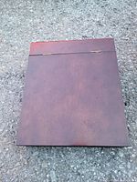 Closed top view of the rectangular wooden storage box showing the smooth, dark polished lid with visible hinges.