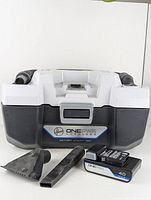 Front view of the Hoover ONEPWR cordless wet/dry utility vacuum with battery and two black nozzle attachments arranged in front.