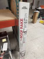 Photo of boxed Ames True Temper Roof Rake showing brand name, product type, weight, and features on packaging.