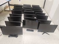 Front view of 27 black computer monitors arranged in rows, showing screens, stands, and bases.
