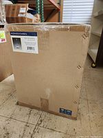 Boxed Quoizel chandelier with label showing model KDN5004BN