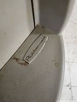 Close-up of Rubbermaid label inside the trash can