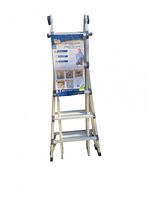 Full view of the ladder standing upright showing instruction guide attached at the top.