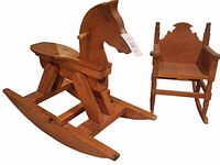 Angled view of solid wood rocking horse and matching rocking chair on white background