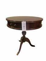 Round mahogany side table with single drawer and tripod pedestal base, some water marks on top.