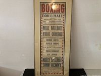 Full vertical view of the framed boxing event poster showing text and overall condition.