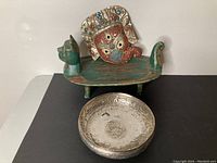 Overview of all three pieces: wooden tray, metal bowl, and decorative mask