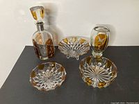 Full view of the 5-piece set including decanter with stopper, vase, two bowls, and dish on stand.