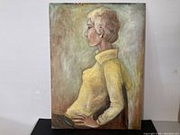 Full view of the vintage oil painting showing a woman in a yellow sweater seated in profile.