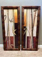 Front view of two framed bamboo-themed wall art prints displayed side by side.