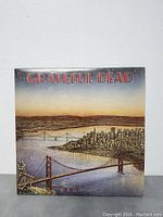 Front cover of Dead Set vinyl album with illustrated San Francisco scene and skeleton figure on Golden Gate Bridge.