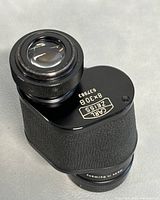 Top view of black Carl Zeiss monocular showing lens with 8x30B and serial number 637983 marked on body.