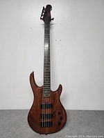 Full front view of the bass guitar against wall