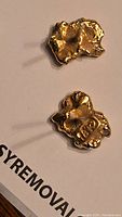 Two gold nugget studs displayed front and back on a white background