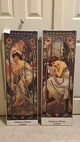 Full view of both matching Alphonse Mucha art panels side by side, showing overall design and size.