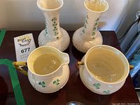 All four porcelain pieces arranged on table