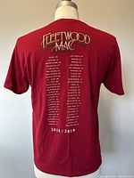 Back of maroon Fleetwood Mac 2018/2019 tour t-shirt showing tour dates and locations in white print.