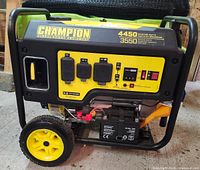 Front and side view of generator showing control panel, outlets, churn wheels, frame and battery