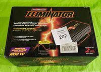 Closed box of Motomaster Eliminator 1000W power inverter showing branding and specifications.