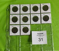 Ten Canadian Edward VII large cents, each in a 2x2 white cardboard coin holder with clear plastic window. Dates from 1902-1910, arranged in two rows, displayed on a green background.