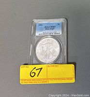 Front side of the 1994 US Silver Eagle coin in PCGS slab labeled MS65.