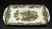 Top view of the Ridgway Staffordshire Heritage rectangular dessert tray featuring a scenic central image and decorative border.