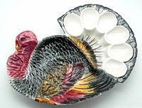 Top front view of the vintage turkey platter showing hand painted details and seven rounded compartments for serving.