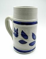 Front and side views of the salt glaze pottery stein showing cobalt blue leaf motif and handle.
