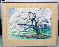 Framed watercolor painting mounted on beige mat board within a simple silver frame, showing entire artwork.