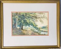 Full view of the framed watercolor painting showing the pastoral landscape with trees, path, and river.