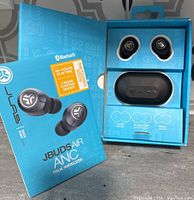 Opened box showing JLab JBuds Air ANC true wireless earbuds, charging case, and three sets of ear tips in packaging