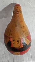 Photo of front side of vintage carved Santa Claus gourd showing detailed carving and painted suit