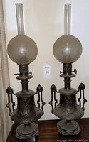 Pair of lamps on table showing full view of both converted oil lamps