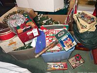 Boxes containing artificial wreath pieces, gift boxes, ornaments and gift wrap